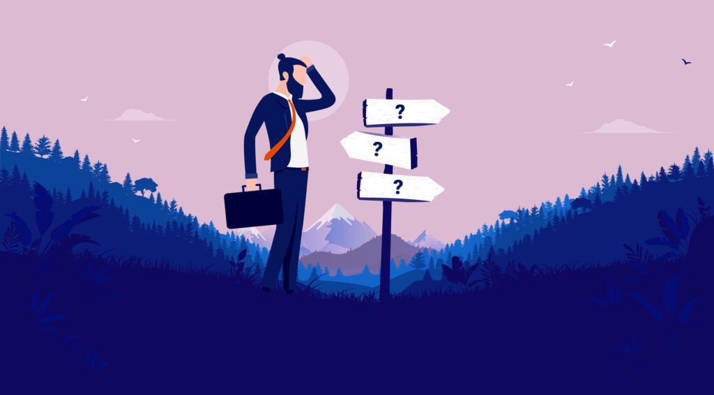 A businessman stands at a crossroads of three signs that all have question marks.