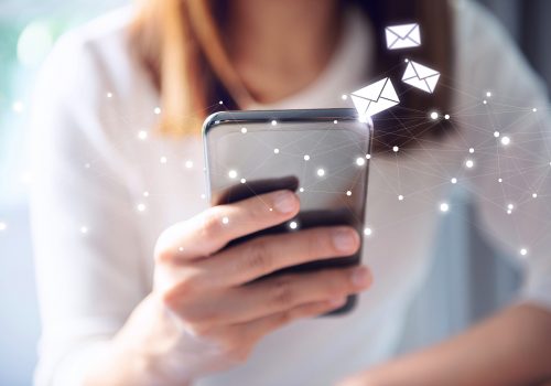 Email prospecting Email concept, Closeup Woman hand using mobile smartphone with email icon.